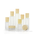 High-grade Cosmetic transparent Frosted glass bottles/jars with wood grain cap